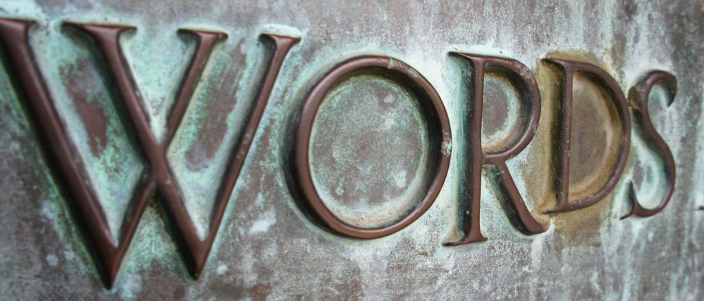 “Words” carved in metal