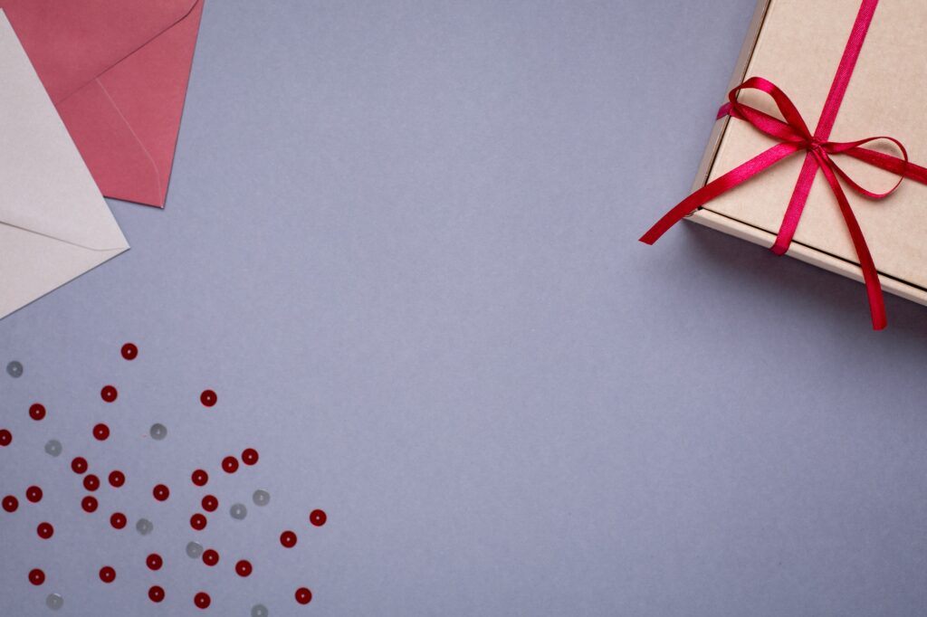 Gray background with gift envelopes and gift box